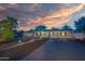 Inviting single-story home with a desert landscaped front yard, lighting, and walkway at 1644 W Roma Ave, Phoenix, AZ 85015