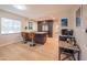 Open-concept kitchen offers modern design elements, granite countertops, seating, and natural light from nearby windows at 1644 W Roma Ave, Phoenix, AZ 85015