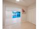 Open concept living space, with access to the backyard. Features bright lighting and closet storage at 1644 W Roma Ave, Phoenix, AZ 85015