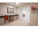 Home office with built-in desk and storage, with view to open concept space at 1644 W Roma Ave, Phoenix, AZ 85015