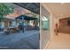 Covered outdoor patio with built in grill, picnic table, and easy access to the home's interior at 1644 W Roma Ave, Phoenix, AZ 85015