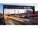 Night view of Melrose street with cars and lights. Melrose sign is visible at 1644 W Roma Ave, Phoenix, AZ 85015