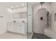 Modern bathroom featuring a double sink vanity, a large mirror, and a walk-in shower with stone surround at 17 W Vernon Ave # 121, Phoenix, AZ 85003