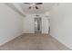 Spacious bedroom with neutral carpet and doorway to the bathroom and hall at 17 W Vernon Ave # 121, Phoenix, AZ 85003