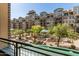 Exterior view of a landscaped community courtyard in front of a luxury condo building with a gazebo and seating at 17 W Vernon Ave # 121, Phoenix, AZ 85003
