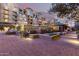 Well-lit courtyard with string lights, benches, and water feature at dusk at 17 W Vernon Ave # 121, Phoenix, AZ 85003