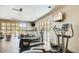 Community gym features treadmills, exercise equipment, and a wall of windows overlooking the pool at 17 W Vernon Ave # 121, Phoenix, AZ 85003