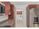 Kitchen features granite countertops, stainless steel appliances, and wood cabinets at 17 W Vernon Ave # 121, Phoenix, AZ 85003