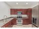Kitchen features granite countertops, stainless steel appliances, and wood cabinets at 17 W Vernon Ave # 121, Phoenix, AZ 85003