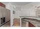 Kitchen features granite countertops, stainless steel appliances, and wood cabinets at 17 W Vernon Ave # 121, Phoenix, AZ 85003