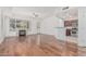 Inviting living room with a fireplace and hardwood floors that flows into the kitchen at 17 W Vernon Ave # 121, Phoenix, AZ 85003