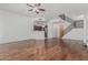 Bright living room features hardwood floors, stainless kitchen appliances and modern staircase at 17 W Vernon Ave # 121, Phoenix, AZ 85003