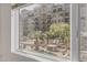 Window view with a garden and a luxury building in the background at 17 W Vernon Ave # 121, Phoenix, AZ 85003