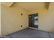 Back patio featuring textured walls and a sliding glass door to the home interior at 17953 N Lettere Cir, Maricopa, AZ 85138