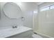 Clean bathroom features a vanity with a sink and a tub/shower combination at 17953 N Lettere Cir, Maricopa, AZ 85138