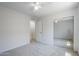Bright bedroom features neutral carpet and closet access at 17953 N Lettere Cir, Maricopa, AZ 85138