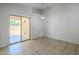 Bright dining area with tile floors and sliding glass door to patio, perfect for entertaining at 17953 N Lettere Cir, Maricopa, AZ 85138