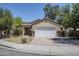 Charming single-story home with a two-car garage and well-maintained front yard at 17953 N Lettere Cir, Maricopa, AZ 85138