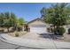 Attractive single-story home featuring a two-car garage and a neatly landscaped front yard at 17953 N Lettere Cir, Maricopa, AZ 85138