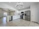 Modern kitchen boasts white cabinets, stainless steel appliances, and an island for dining and food prep at 17953 N Lettere Cir, Maricopa, AZ 85138