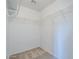 Walk-in closet with carpet flooring and built-in wire shelving for optimal storage at 17953 N Lettere Cir, Maricopa, AZ 85138