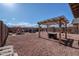 Large backyard featuring pergola, a fire pit, seating, and a grill at 18586 N Lariat Rd, Maricopa, AZ 85138