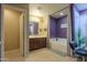 Nicely decorated bathroom with a tub and wood cabinets at 18586 N Lariat Rd, Maricopa, AZ 85138