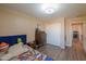 Comfortable bedroom with closet, ceiling fan, and wood floors at 18586 N Lariat Rd, Maricopa, AZ 85138