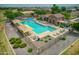 Aerial view of the community pool area with lounge chairs and shade structures at 18586 N Lariat Rd, Maricopa, AZ 85138