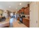 Well-lit kitchen featuring stainless steel appliances, granite countertops, and tile flooring at 18586 N Lariat Rd, Maricopa, AZ 85138