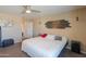 Bright main bedroom with neutral carpet and decor, ceiling fan and accent lighting at 18586 N Lariat Rd, Maricopa, AZ 85138