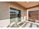 View of the covered patio with sliding glass door access to the home's interior at 18586 N Lariat Rd, Maricopa, AZ 85138