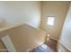 Staircase leading upstairs with wooden steps and natural light at 18586 N Lariat Rd, Maricopa, AZ 85138