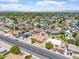 Aerial view of the property in a residential neighborhood with mountain views in the distance at 1902 E 8Th St, Mesa, AZ 85203