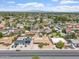 Aerial view of the property in a residential neighborhood with mountain views in the distance at 1902 E 8Th St, Mesa, AZ 85203