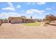 Landscaped backyard with gravel, small lawn, trees, and covered patio; great for outdoor living at 1902 E 8Th St, Mesa, AZ 85203
