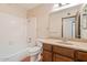 Bathroom featuring a shower-tub combo, vanity and tile floor at 1902 E 8Th St, Mesa, AZ 85203