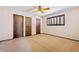 Bedroom with neutral carpet, ceiling fan and plenty of closet space at 1902 E 8Th St, Mesa, AZ 85203