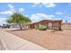 Charming home featuring arched windows, desert landscaping, and a covered carport at 1902 E 8Th St, Mesa, AZ 85203