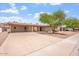 Well-maintained single-story home boasting a spacious driveway and covered carport, perfect for easy access at 1902 E 8Th St, Mesa, AZ 85203