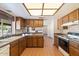 Kitchen featuring wood cabinets, countertop, tile floor and modern appliances at 1902 E 8Th St, Mesa, AZ 85203