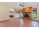 Living room with a brick fireplace and terracotta tile flooring at 1902 E 8Th St, Mesa, AZ 85203