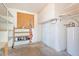 Utility room with built in shelves, a water heater, and room for storage at 1902 E 8Th St, Mesa, AZ 85203