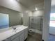 Bathroom with a large mirror, a vanity with sink, and a walk-in shower at 2011 E Bucking Bronco Dr, San Tan Valley, AZ 85140