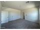 Bedroom featuring carpeted floors, neutral walls, and closet space at 2011 E Bucking Bronco Dr, San Tan Valley, AZ 85140