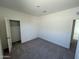 Clean bedroom featuring plush carpet, white walls, and ample closet space at 2011 E Bucking Bronco Dr, San Tan Valley, AZ 85140
