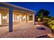 Wonderful covered patio with brick floors, outdoor kitchen, and a firepit with a gorgeous water feature at 22208 N San Ramon Dr, Sun City West, AZ 85375