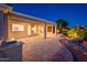 Inviting covered patio with outdoor kitchen and a captivating water feature next to the community golf course at 22208 N San Ramon Dr, Sun City West, AZ 85375