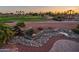 Backyard view features lush landscaping, attractive water feature and scenic views of the golf course at 22208 N San Ramon Dr, Sun City West, AZ 85375