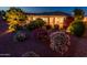Backyard with patio and mature landscaping at night at 22208 N San Ramon Dr, Sun City West, AZ 85375